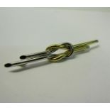 An art deco style 18ct two colour gold bar brooch, 7.5cms l. 6g.