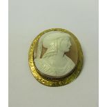 A Greek warrior cameo brooch of oval form set in a 9ct gold engraved mount. 5cms w.
