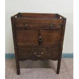 A George III mahogany tray top bedroom commode with pull out drawer over pot cupboard and having one