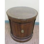 A 20c mahogany Georgian style drum table of circular form with a parquetry top within a wide cross
