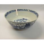 A 19c Chinese bowl with base rim blue and white decorated with pagoda and village scenes, waterway