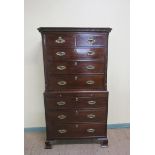 A George III mahogany chest on chest, the upper section of two short and three long drawers with