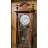 A late 19c American spring driven Vienna Regulator in glazed walnut case with fluted columns