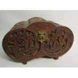 A late 19/early 20c Oriental box of lobed form, panel carved with village and coastal scenes.