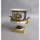 A late 19c Royal Worcester vase painted with fruit and having gilt Eagle handles, the pedestal