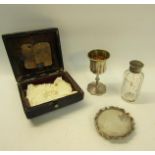 A Victorian travelling communion set with communion cup. 9cms h, a paten on a circular short stand