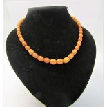A string of forty five butterscotch amber beads of graduated size. 44cms l. Total weight 14.3g.