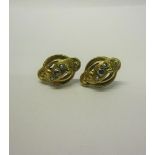 A pair of gold Diamond set earrings