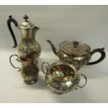 A four piece silver tea and coffee service of baluster form. The coffee and tea pot with hinged,