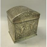 A Victorian silver early Keswick School of Industrial Art tea caddy with hinged dome cover. Embossed