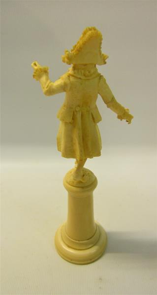A late 19c carved ivory figure of a Dandy, supported on a tapering plinth with circular plinth. - Image 2 of 3