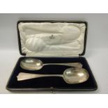 Two silver table spoons, plain triffid handles. Makers mark for Holland Aldwinckle & Slater,
