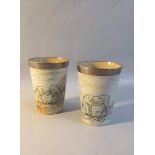 A pair of Doulton Lambeth Hannah Barlow silver rimmed stoneware beakers, incised with horses,