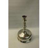 A 19c Continental silver bell base candlestick with a double knop stem and fixed socket with