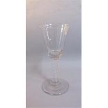 An 18c English wine glass with a clear bucket bowl on double series white opaque twist stem, with