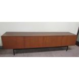 An Ideal Heim teak sideboard of substantial form fitted with six pull-out shelves and one deep