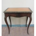 A 19c French rosewood writing table or rectangular form, the top with tooled leather insert within a