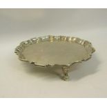 A Georgian style silver card tray with a raised shaped border. Makers mark for Sydney & Co.,