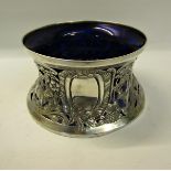 An Irish silver potato ring in a late 18c style, with a shepherd, sheep and goats within leaf flower