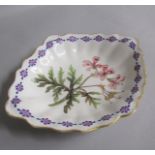 An early 19c Derby oval dish of lobed form painted with Geraniums within a border of Carnation