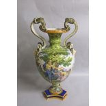A 19c Ginori two handled faience vase on a tripartite base, painted with figures beneath an oak tree