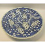 A 19c Chinese blue and white circular dish decorated with Prunus blossom, 29cms dia.