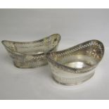 A pair of Edwardian late Georgian style silver plated boat shaped bowls, pierced and with cast