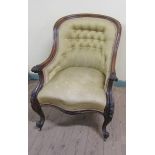 A mid Victorian walnut show frame and button upholstered armchair, the down swept arms with scroll