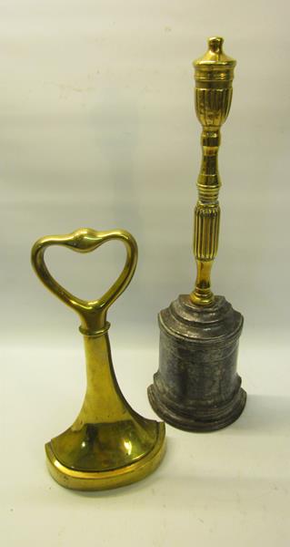 Two 19c brass and iron doorstops both with carry handles, one with base marked AK & Sons for