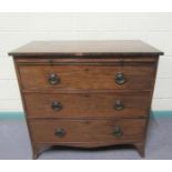 A late Georgian mahogany chest of three long graduated drawers with a slide, supported on splayed