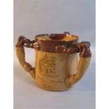 A Doulton Lambeth stoneware hunting tyg with greyhound handles, glazed in brown, impressed marks