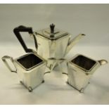 An art deco three piece tea service of facet angular form with teapot, sucrier and cream jug. Makers