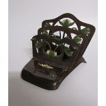An art nouveau letter stand stamped DJM 237670 E S. Gesch. Bronze patinated, the three divisions