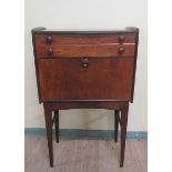 A Younger Limited teak secretaire fitted two long drawers over fall front fitted secretaire and