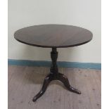 A George III oak circular pedestal tripod table 73cms dia x 64cms h.