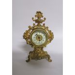 A late 19c American mantel clock by the Amsonia Clock Co. in rococo cast gilt case embellished
