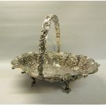 A late Victorian silver basket with swing handle. The basket with a shaped gadrooned formed rim with