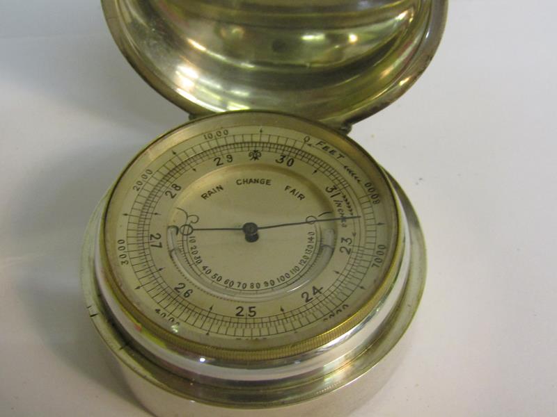 A late 19c pocket aneroid barometer and thermometer. The 4.5cms dia silvered dial indicates inches - Image 3 of 5