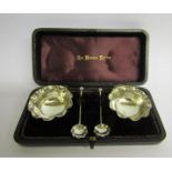 A late Victorian silver set of two salt pots with spoons in presentation box, makers mark for S.