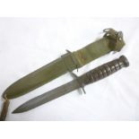 An original World War II United States M3 fighting knife with single-edged blade and Arsenal marked