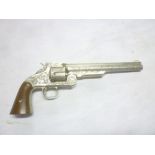 A replica 19th Century Western six-shot revolver with engraved frame