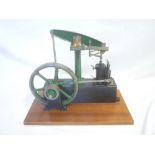 A good quality Stuart steam beam pumping engine with fly wheel No.