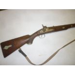 A 19th Century percussion single barrel sporting gun with damascus barrel,