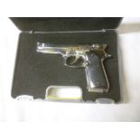 A miniature replica United States M92F 9mm pistol,