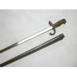 A French Gras bayonet with triangular steel blade dated 1877 in steel scabbard