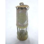 A brass and steel type 6 miner's lamp by the Protector Lamp & Lighting Co Ltd,