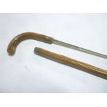 An old swordstick with steel square section blade in rustic walking stick mounts