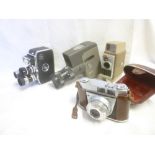 A Bolex Paillard triple lens cine camera, Belle and Howell autoset cine camera,