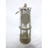 A brass and steel type 1a miner's lamp by the Protector Lamp & Lighting co.