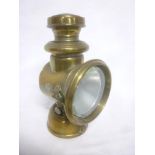An old brass motoring lamp by Powell & Hanmer Ltd,